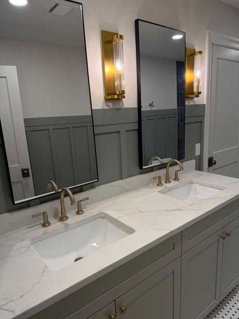Quartz double vanity — brass fixtures & board-and-batten