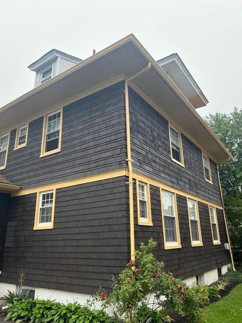 Cedar-shake exterior with fresh gold trim