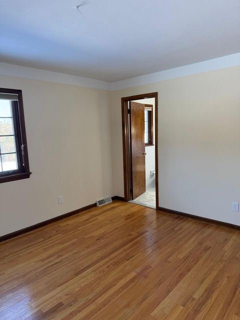 Interior repaint — warm white over oak floors